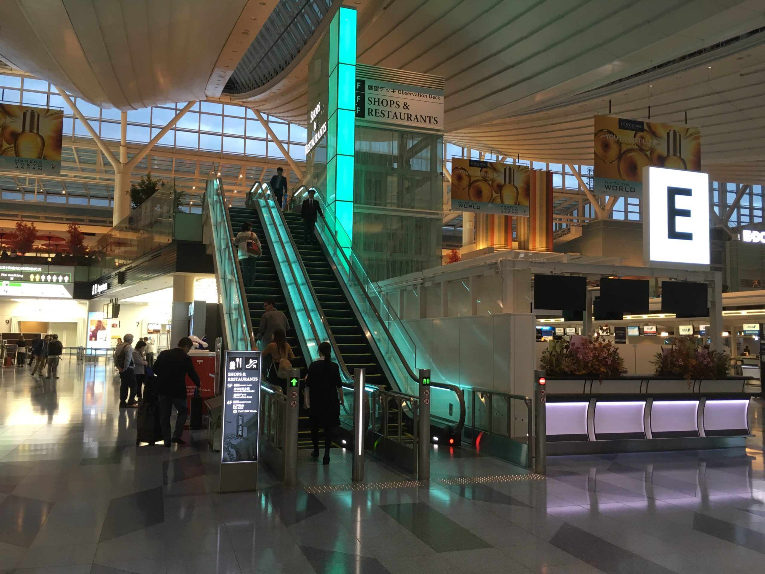 haneda airport escalator to the 2nd floor with shops and restaurants